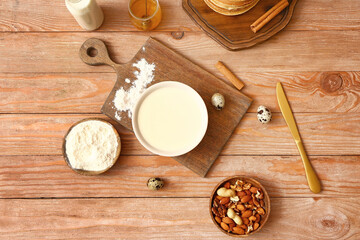 Fototapeta na wymiar Ingredients for pancakes on table