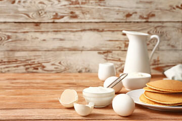 Ingredients for pancakes on table