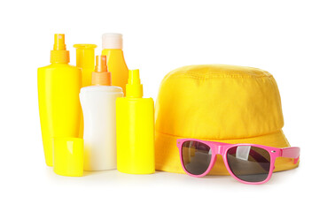 Beach accessories with sunscreen cream on white background