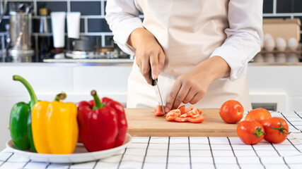 Asian woman is preparing healthy food vegetable salad at light kitchen Cooking At Home and healthy food concept
