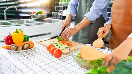 Asian woman is preparing healthy food vegetable salad at light kitchen Cooking At Home and healthy food concept
