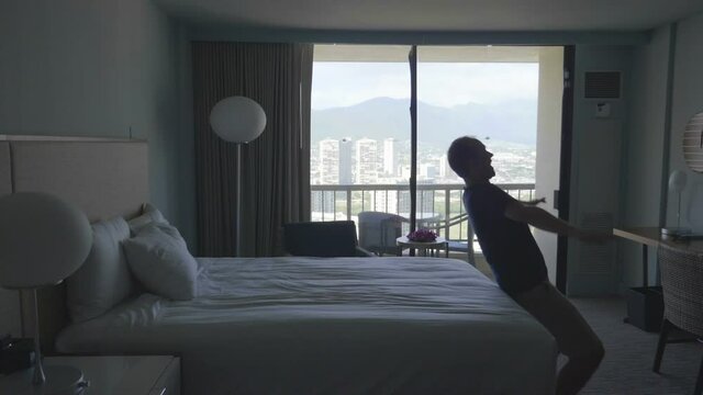 Man jumping on the bed in slow motion 180fps
