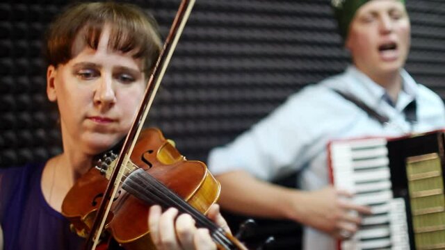 a woman plays the violin