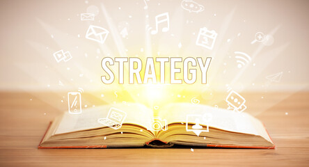 Opeen book with STRATEGY inscription, business concept