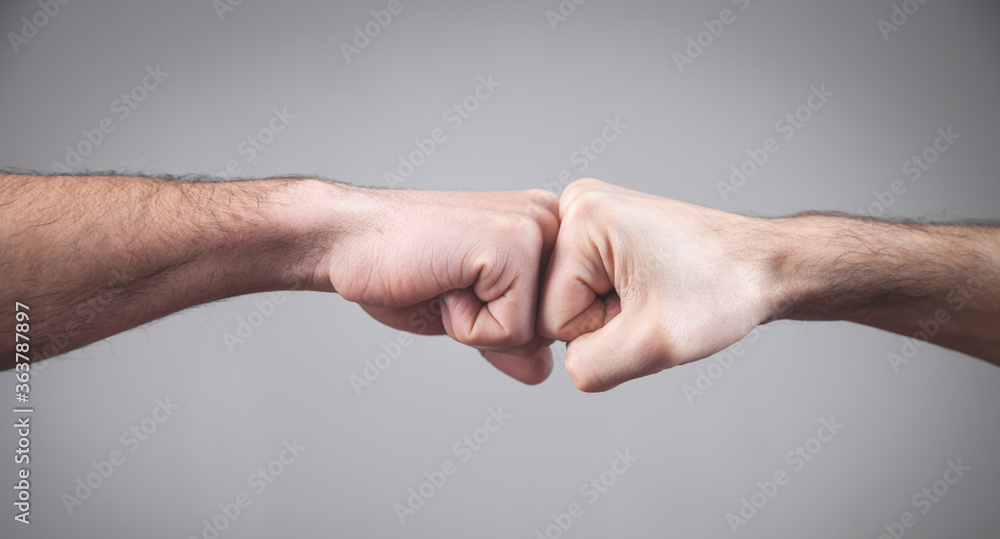 Poster  Close-up. Two fists hitting each other. Fight