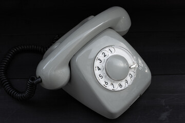 Disc phone on wooden background