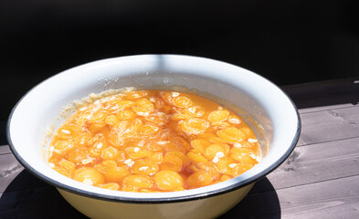 Apricot jam on a wooden background