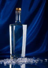 Obraz na płótnie Canvas bottle of vodka on blue background