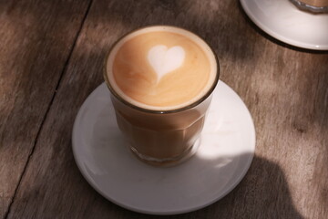 coffe latte cup on a wood table.