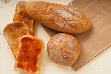 Group of many type of bread on a plate.