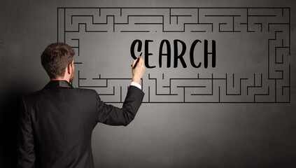 businessman drawing maze with SEARCH inscription, business education concept