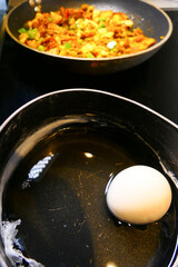 A hard-boiled egg in a pot with water