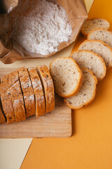 Group of many type of bread on a plate and cooking flour.