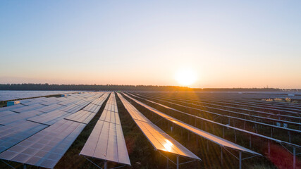 Fototapeta premium Photovoltaic solar panels at sunrise and sunset.