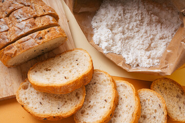 Group of many type of bread on a plate and cooking flour.