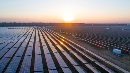 Photovoltaic solar panels at sunrise and sunset.