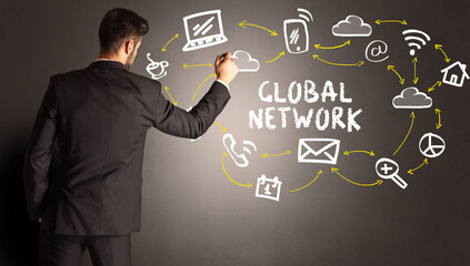 businessman drawing social media icons with GLOBAL NETWORK inscription, new media concept