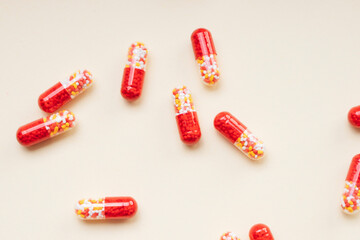 Red pill capsules and molecules as medical concept.