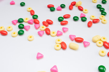 Colourful medcine pills over white background.