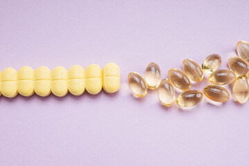 Transparent yellow capsule of drug, vitamin or fish oil.