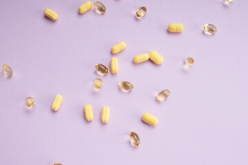 Transparent yellow capsule of drug, vitamin or fish oil.