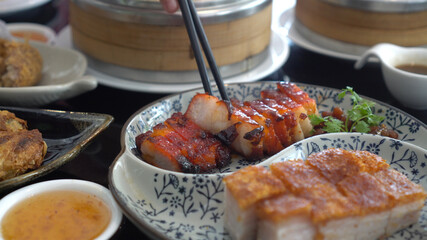 Chopsticks honey barbecue pork crispy Hong Kong Cantonese traditional cuisine