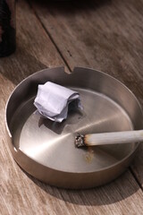 cigarettes burned in an ashtray during the day
