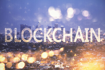 Multi exposure of cryptocurrency theme hologram drawing and city veiw background. Concept of...