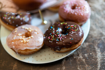 Donuts glazed with sugar and milk chocolate and ruby. Vintage style composition