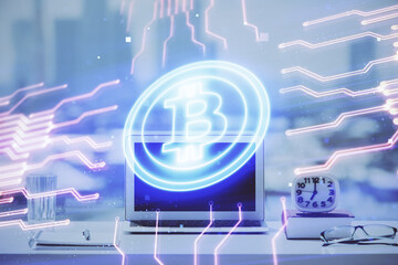 Double exposure of blockchain and crypto economy theme hologram and table with computer background....