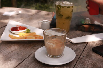 coffe latte cup on a wood table.