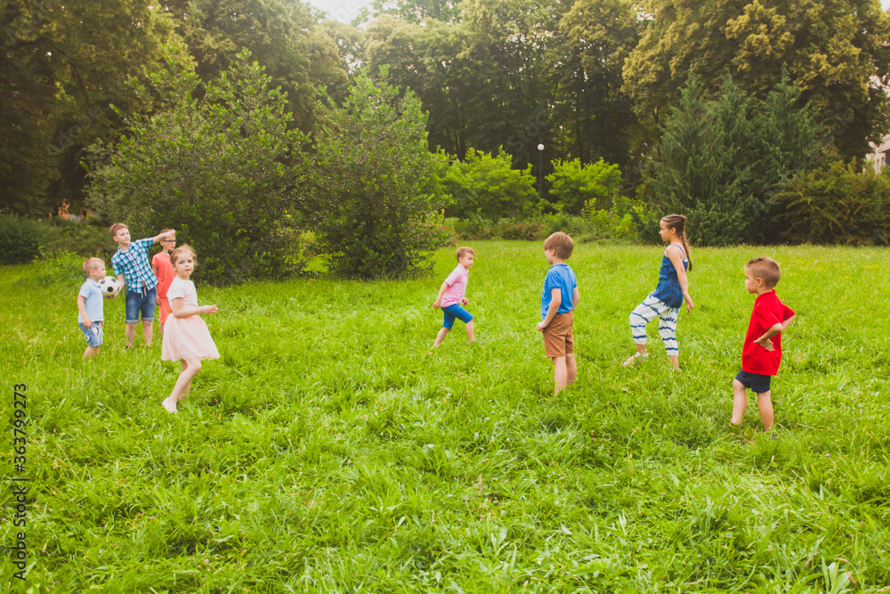 Canvas Prints The children have fun and play sports with a ball