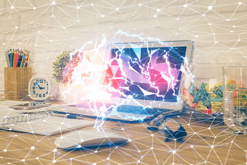 Double exposure of work space with computer and human brain drawing hologram. Brainstorm concept.
