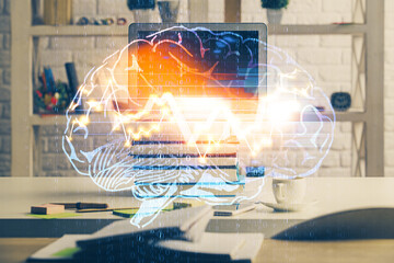 Double exposure of work space with computer and human brain drawing hologram. Brainstorm concept.