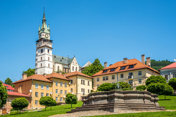 Fototapeta na wymiar View at the Baroq fountain with Town Castle in Kremnica, Slovakia