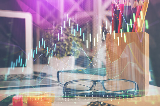 Financial chart hologram with glasses on the table background. Concept of business. Double exposure. - Powered by Adobe