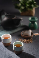 Japanese tea setting on a dark background and winter colours