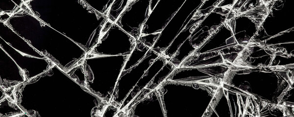 white cracks on a black glass surface, abstract, texture