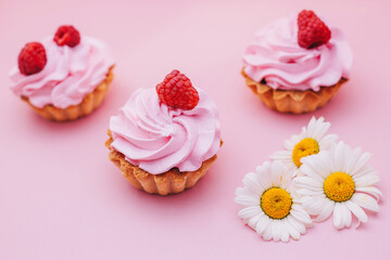 cupcakes with pink icing and sprinkles