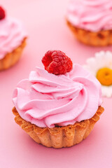 cupcakes with pink frosting and sprinkles