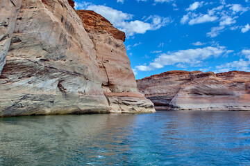 View of narrow, cliff-lined canyon from a boat in Glen Canyon National Recreation Area, Lake Powell, Arizona