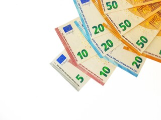Euro money is papered on a white background.