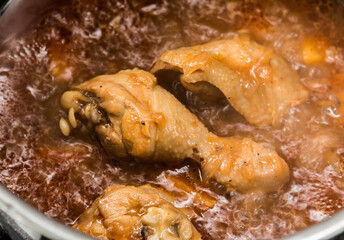 Boiling chicken with sauce in pot, in door  Chiangmai  Thailand