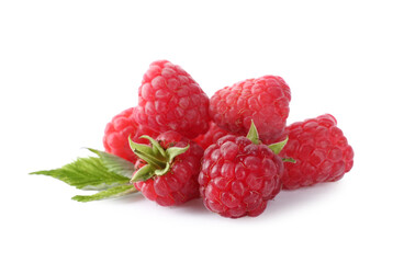 Pile of fresh ripe raspberries with leaves isolated on white
