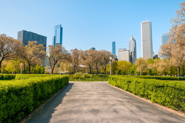 Fototapeta na wymiar Gardens of Chicago Grant Park with skyscrapers on background, Illinois, USA