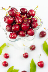 Fresh cherry in a tall glass isolated on white background. fresh ripe cherries. sweet cherries.