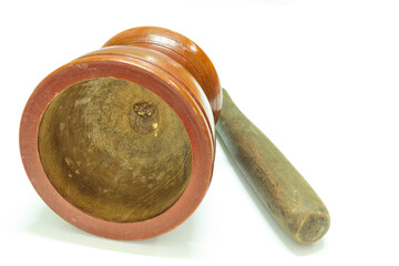 Wooden mortar with pestle on white background