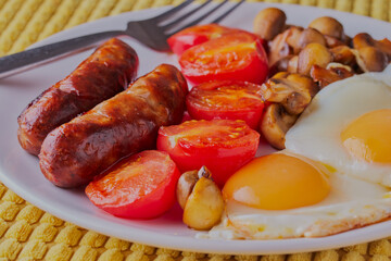 Junk food fried breakfast on a plate.