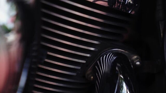 The engine of a Harley Davidson motorcycle. High quality dark shot.