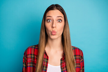 Close-up portrait of her she nice attractive pretty lovely cute lovable funny long-haired girl wearing checked shirt sending air kiss isolated over bright vivid shine vibrant blue color background